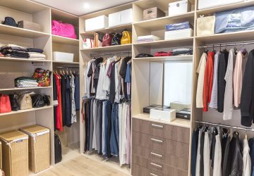 big-wardrobe-with-different-clothes-dressing-room-min